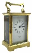 An early 20th century eight-day French Corniche cased timepiece carriage clock with a platform cylin