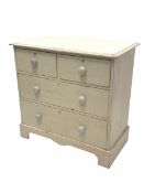 20th century white painted chest fitted with two short over two long drawers