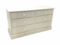 White painted chest fitted with six drawers on a skirted base W136cm
