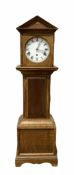 Oak cased granddaughter clock