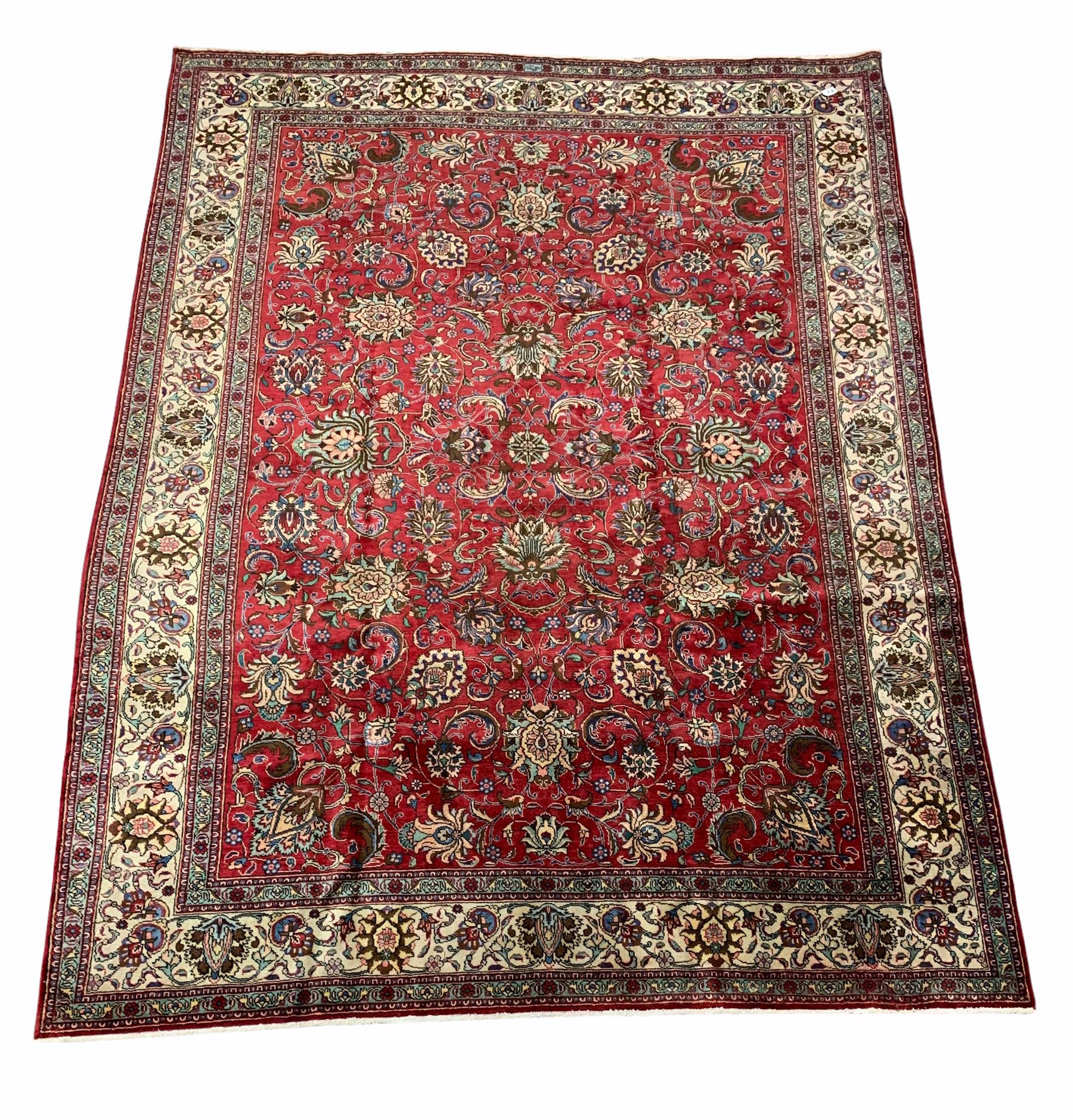 Larger persian hand knotted red ground rug