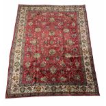 Larger persian hand knotted red ground rug