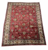 Larger persian hand knotted red ground rug