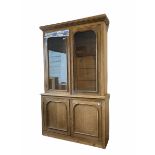 Large Edwardian oak and pine bookcase on cupboard