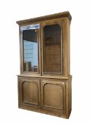 Large Edwardian oak and pine bookcase on cupboard