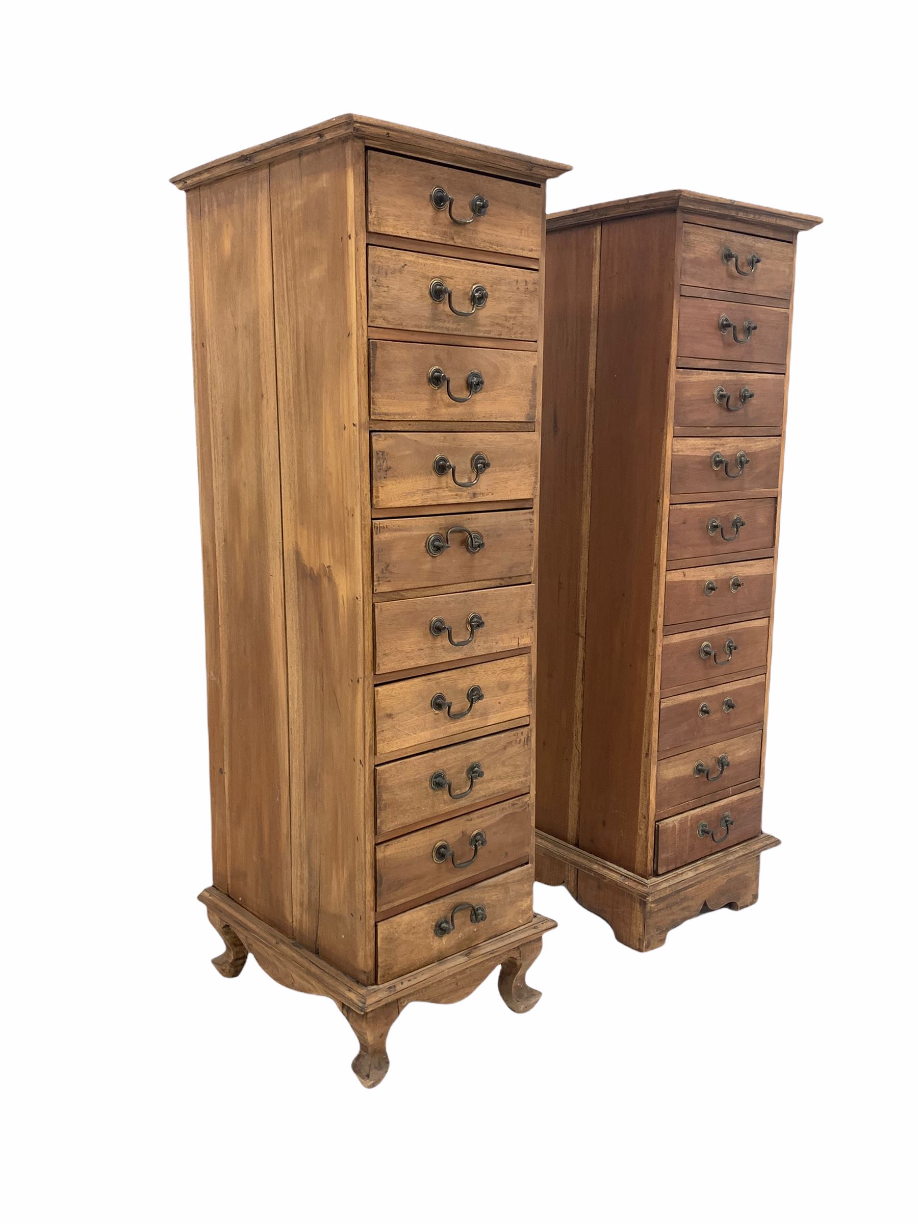 Two 20th century hardwood tall chests fitted with ten drawers