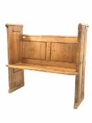 Early 20th century pine pew with panelled back and sides W121cm