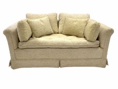 Two seat sofa upholstered in beige fabric