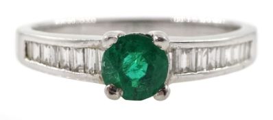 Platinum round emerald ring