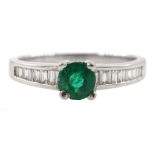 Platinum round emerald ring