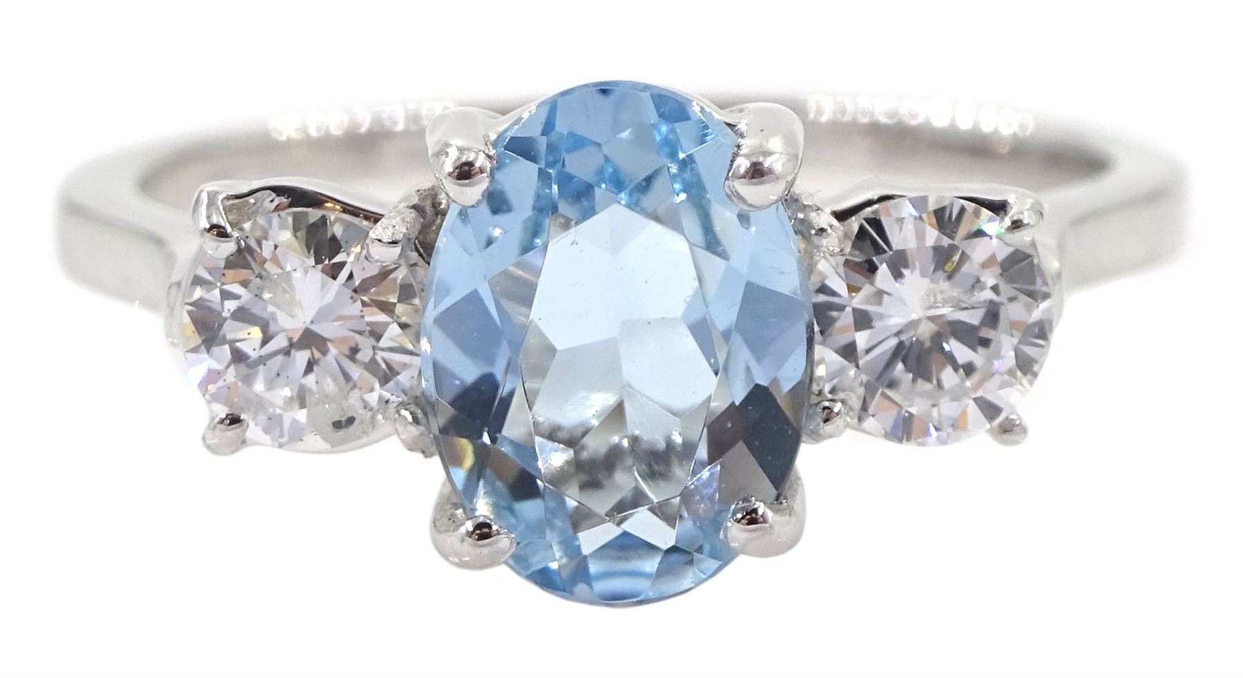 18ct white gold three stone oval aquamarine and round brilliant cut diamond ring