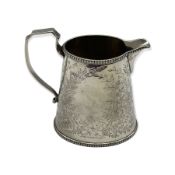 Victorian silver milk jug of oval design engraved with trailing foliage