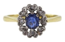 Gold oval sapphire and diamond cluster ring