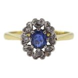 Gold oval sapphire and diamond cluster ring