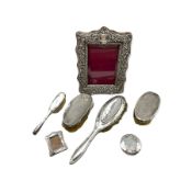 Late Victorian silver upright photograph frame with embossed decoration 22cm x 16cm Birmingham 1900