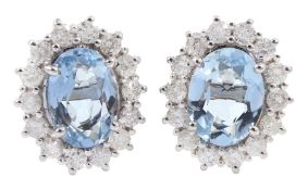 Pair of 18ct white gold aquamarine and diamond stud earrings