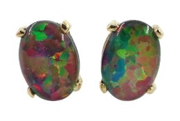 Pair of gold oval opal stud earrings