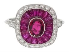 Platinum ring set with central oval ruby