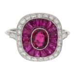 Platinum ring set with central oval ruby