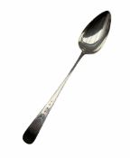 George III Irish silver basting spoon with engraved stem Dublin 1801 Maker William Ward and with a c