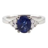 Platinum oval sapphire and six stone diamond ring