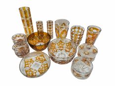 A group of Polish flash amber glassware to include three vases by 'Julia'