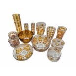 A group of Polish flash amber glassware to include three vases by 'Julia'