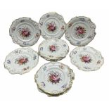 Set of ten Victorian Coalport design dessert plates individually painted with a centre spray of flow