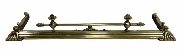 Victorian brass fire fender with reeded and scroll cast corners and matched finials