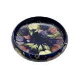 Moorcroft circular bowl decorated with the wisteria and plum pattern