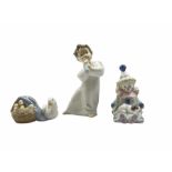Three Lladro figures comprising 'Pierrot with Puppy' 5277