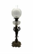 Victorian cast iron oil lamp with faceted glass reservoir