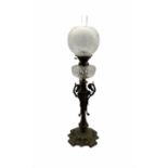 Victorian cast iron oil lamp with faceted glass reservoir