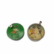 Child's 19th century small circular music box printed with children and snowman and another