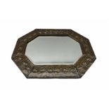 Arts and Crafts octagonal copper mirror with embossed tailing border and bevelled plate