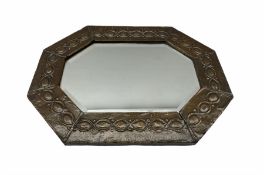 Arts and Crafts octagonal copper mirror with embossed tailing border and bevelled plate