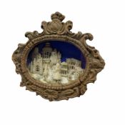 19th century small oval diorama with the figure of a girl in front of classical buildings