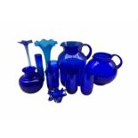 Bristol Blue glass to include two globular form jugs