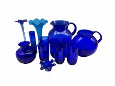 Bristol Blue glass to include two globular form jugs