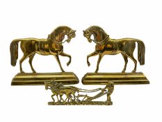 Pair of 19th century brass hearth ornaments in the form of standing horses on a stepped base H23cm a