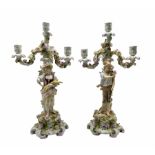 Pair of Sitzendorf porcelain candelabra depicting male and female figures gathering wheat sheaves