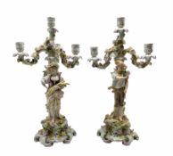 Pair of Sitzendorf porcelain candelabra depicting male and female figures gathering wheat sheaves