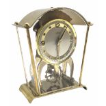 A vintage Schatz & Sohne German eight-day mantle clock with visible oscillating balance