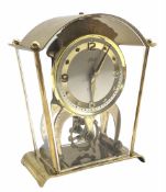 A vintage Schatz & Sohne German eight-day mantle clock with visible oscillating balance