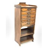 Edwardian walnut sheet music cabinet fitted with five drawers and two open shelves