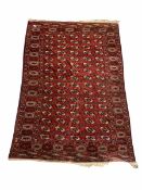 Persian Bokhara red ground carpet