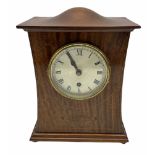 A twentieth century mahogany mantle clock with a waisted case in the art Nuovo style