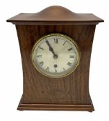 A twentieth century mahogany mantle clock with a waisted case in the art Nuovo style