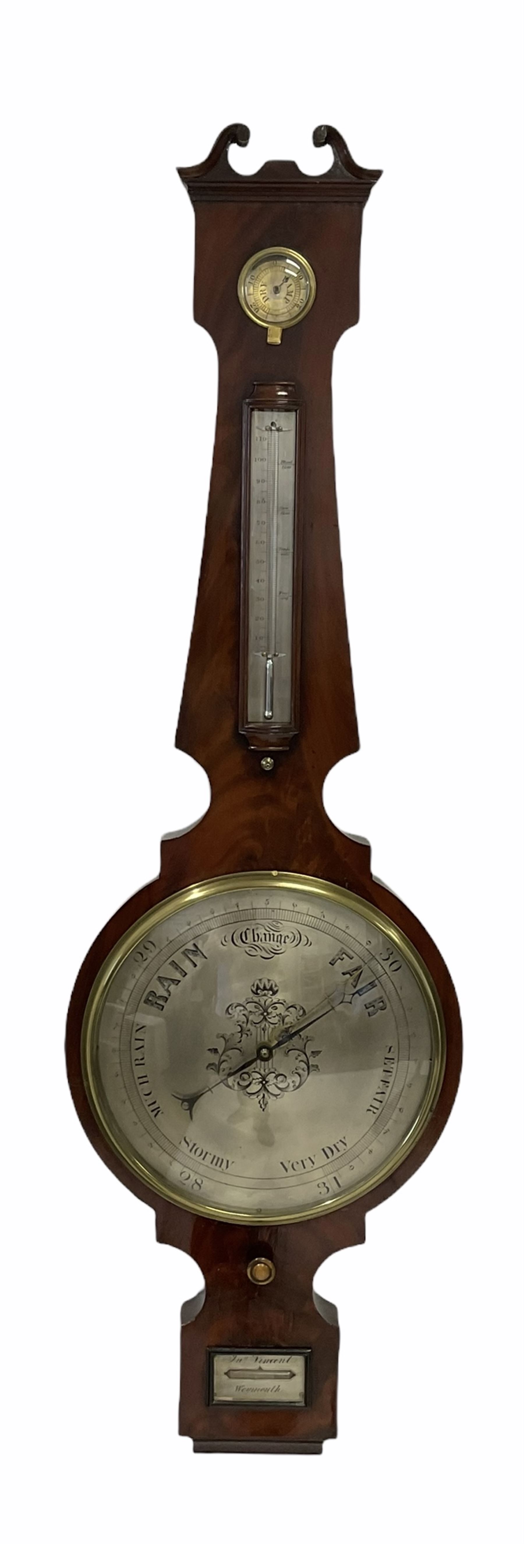 A mid-Victorian four dial mercury wheel barometer in a mahogany veneered case