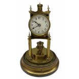 An early 20th century German torsion pendulum clock manufactured by Gustav Becker